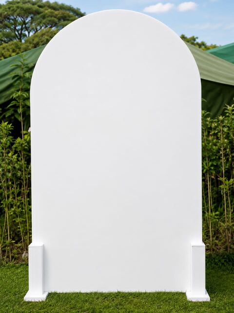 White arch backdrop set up outdoors