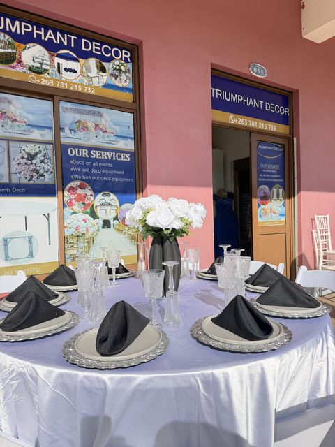 Black, white and silver table setting with white florals, a second angle