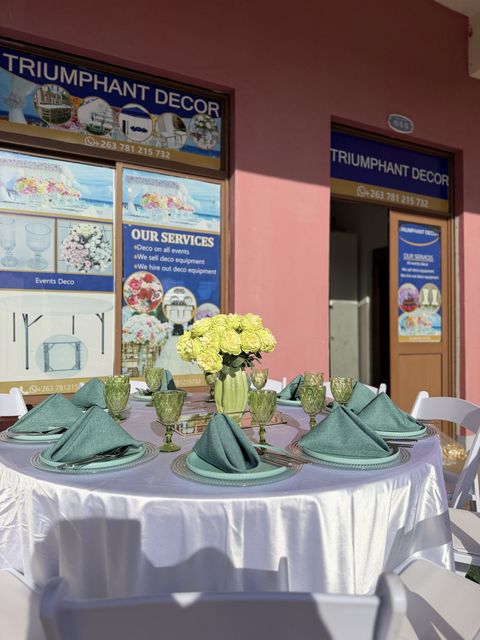 Sage green table setting with silver chargers, a second angle