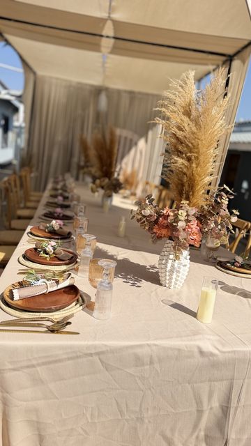 Tigashire Vakwasha reception table with a pampas grass centerpiece, by Triumphant Events